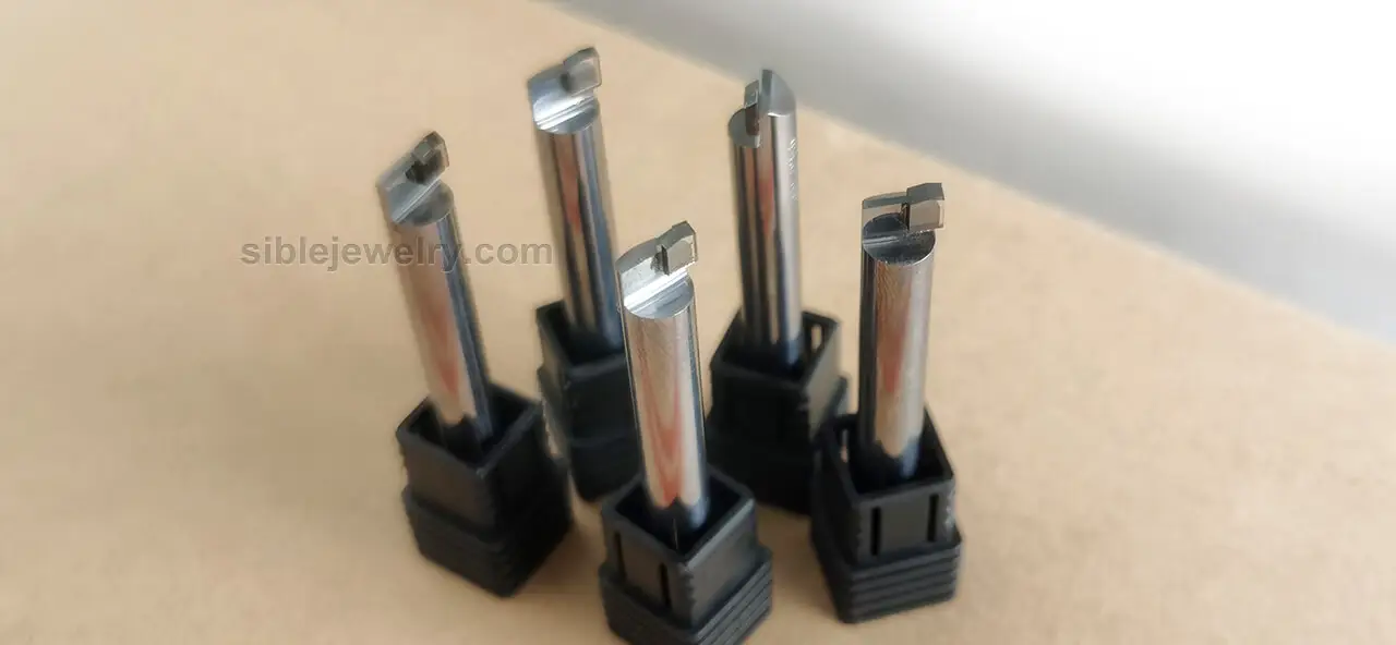 CNC diamond carving and setting tool for jewelry manufacturing, featuring natural or synthetic diamond tips for precision work