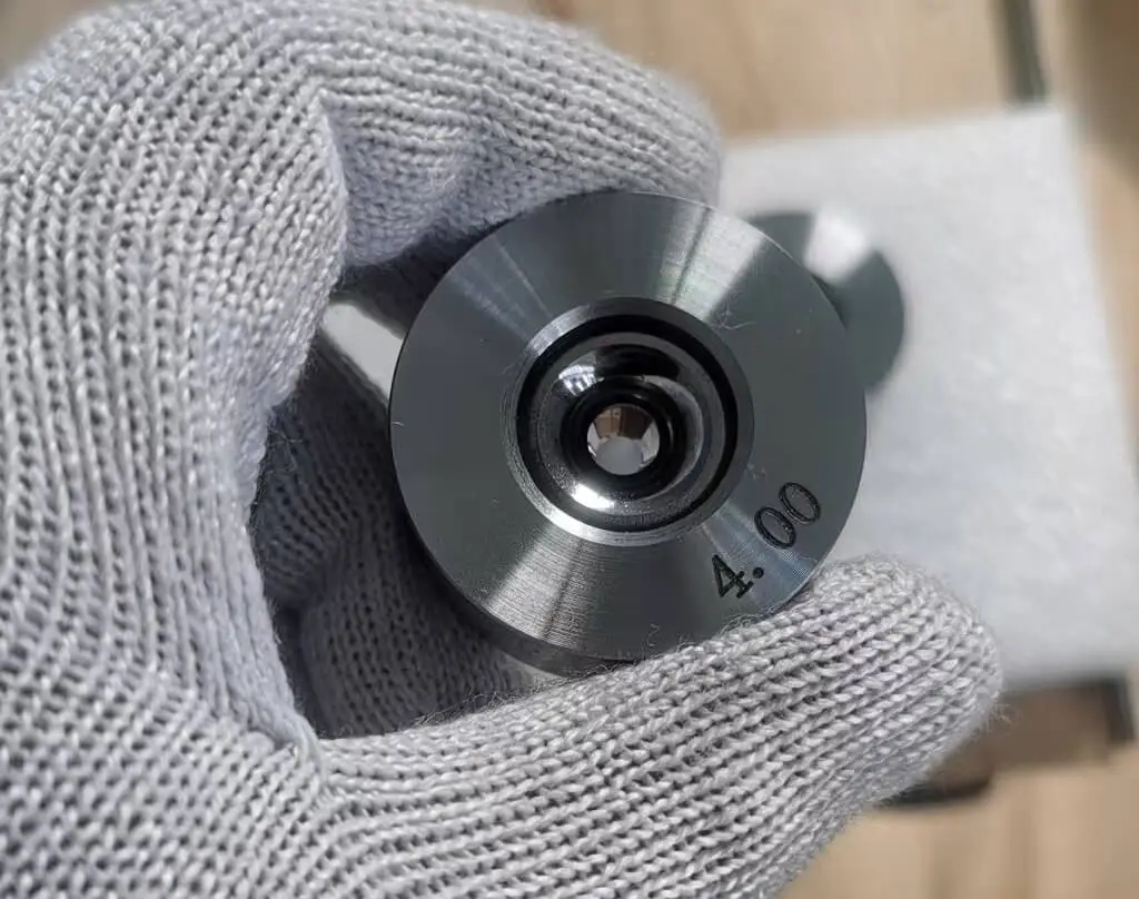 Tungsten carbide vs PCD diamond wire drawing dies comparison, both offering sharp edges and wear resistance